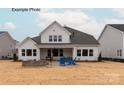 Spacious backyard featuring a patio with outdoor seating, perfect for relaxing or entertaining at 11020 Tyler Brook Ln # Oak0035, Mint Hill, NC 28227