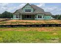 New home in construction phase with visible house wrap and windows installed at 11020 Tyler Brook Ln # Oak0035, Mint Hill, NC 28227