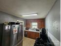 Functional kitchen featuring wood cabinets and stainless steel refrigerator at 1142 Camden Ave, Rock Hill, SC 29732