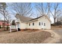 Charming two-story home featuring yellow siding, well-maintained grounds, and a private backyard at 1275 Rocky Creek Rd, Shelby, NC 28152