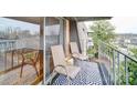 Relaxing balcony featuring stylish black and white carpet and outdoor furniture at 1323 Queens Rd # 424, Charlotte, NC 28207