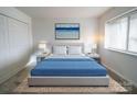 Cozy bedroom featuring a large bed, matching nightstands, and ample natural light at 1323 Queens Rd # 424, Charlotte, NC 28207