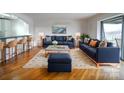 Comfortable living room with hardwood floors and blue sofas at 1323 Queens Rd # 424, Charlotte, NC 28207