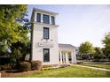 Community clubhouse with manicured lawn, landscaping, and mature trees at 13319 Jacks Ln, Pineville, NC 28134