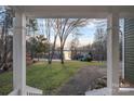 Inviting view from the front porch showcasing the expansive lawn and serene lake in the distance at 1665 Sherwood Ct, Sherrills Ford, NC 28673