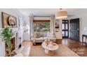 Comfortable living room with a fireplace, hardwood floors, and great natural light at 1720 Fulton Ave, Charlotte, NC 28205