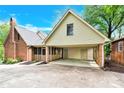 Attached carport with a storage area and screened porch, perfect for outdoor living at 2041 Jefferson Ave, Gastonia, NC 28056