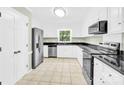 Bright kitchen with stainless steel appliances, white cabinets and granite countertops at 2041 Jefferson Ave, Gastonia, NC 28056