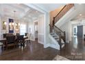 Dining room adjacent to staircase with sleek floors and natural light at 2526 Fort St, Charlotte, NC 28205