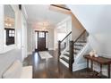 Elegant foyer with hardwood floors, staircase, and ample natural light, creating a grand entrance at 2526 Fort St, Charlotte, NC 28205