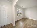 Bright and airy living room with hardwood floors and a large window at 3403 Laurel Oak Ln, Gastonia, NC 28056