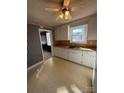 Cozy eat-in kitchen featuring a double sink, wood counters, and ample cabinet space at 3412 1St Avenue Nw Cir, Hickory, NC 28601