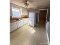 Bright kitchen with a refrigerator and an adjoining breakfast nook at 3412 1St Avenue Nw Cir, Hickory, NC 28601