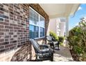 Inviting front porch features wicker rocking chairs and brick facade at 4462 Haddington Dr, Fort Mill, SC 29707