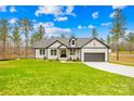 Charming single-Gathering home boasts new construction, a well-manicured lawn, and an attached garage at 5147 Star Magnolia Ct, Clover, SC 29710