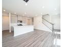 Open living room with gray flooring and ample natural light at 5208 Georgette Trl, Cherryville, NC 28021