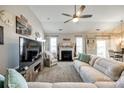 Cozy living room with fireplace, plush seating, and plenty of natural light at 1024 Mayapple Way, Belmont, NC 28012