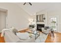 Inviting living room showcasing a fireplace, vaulted ceiling, and hardwood flooring for a cozy ambiance at 1055 Curry Way, Matthews, NC 28104