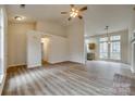 Open living area featuring vaulted ceiling, ceiling fan and views into the kitchen at 106 Aurora Ln # 31, Huntersville, NC 28078