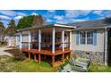 Inviting covered porch with swing and outdoor seating, perfect for relaxing at 1818 Valley Springs Se Dr, Conover, NC 28613