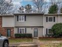 Inviting townhome with gray siding, black shutters, and a well-maintained front yard at 3170 Heathstead Pl, Charlotte, NC 28210