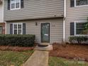 Attractive front entrance with storm door and well-manicured landscaping at 3170 Heathstead Pl, Charlotte, NC 28210