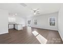 Bright, open living area featuring hardwood floors, neutral decor, and sliding doors to the backyard at 3267 Maple Ridge Dr, Gastonia, NC 28052