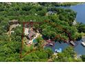 Aerial view of a sprawling property with a luxurious home, pool, and private waterfront access at 1220 Broadside Rd, York, SC 29745