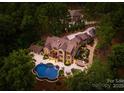 Stunning aerial view of a luxurious estate home with a beautiful pool and lush landscaping at 1220 Broadside Rd, York, SC 29745