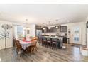 Open-concept kitchen with granite countertops, stainless steel appliances, and a center island with seating at 133 Galley Ln, Statesville, NC 28677