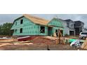 Image showing a home under construction, with visible framework and building materials, indicating the building phase at 2210 Camber Dr # Cwo0075, Gastonia, NC 28054