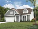 Charming home featuring gray siding, stone accents, and a well-manicured lawn at 2210 Camber Dr # Cwo0075, Gastonia, NC 28054