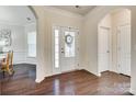 Bright entryway with hardwood floors, arched doorways, and views into the dining area at 2314 Talon Point Cir, Fort Mill, SC 29715
