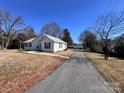 Quaint one-story home with a long driveway and a detached garage, perfect for storage or a workshop at 2507 Florida Ave, Kannapolis, NC 28083