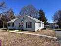 Inviting one-story home with neat landscaping and a walkway leading to the front entrance with good sunlight at 2507 Florida Ave, Kannapolis, NC 28083