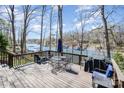 Beautiful deck overlooking the lake, furnished with a table, chairs and grill, ideal for outdoor entertaining at 353 Whippoorwill Rd, Mooresville, NC 28117