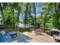Spacious wooden deck with lake views, outdoor seating and dining. Perfect for entertaining and enjoying the scenery at 353 Whippoorwill Rd, Mooresville, NC 28117
