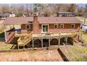 Spacious brick home showcasing an expansive wooden deck and a well-kept backyard at 3617 12Th Street Ne Dr, Hickory, NC 28601