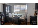 Bright dining area with a glass-topped table, modern chairs, and natural light at 4343 Saluda Rd, Rock Hill, SC 29730