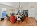 Bright living room features hardwood floors, fireplace, and ample seating, perfect for relaxing at 7509 Thorn Creek Ln, Tega Cay, SC 29708
