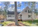 Charming home exterior with vertical siding and an inviting front porch at 2139 Peninsula Dr, Clover, SC 29710