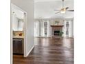 Spacious living room featuring a fireplace, hardwood floors, and vaulted ceiling at 214 Bubbling Well Rd, Denver, NC 28037