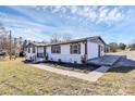 Cozy home with a covered patio and neatly maintained landscaping at 2159 Greenleaf Rd, Clover, SC 29710