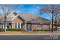 Charming brick and stone townhouse with manicured landscaping and inviting curb appeal at 2937 Bellasera Way, Matthews, NC 28105