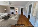 Virtual staging presents a bright living room featuring neutral furniture, fireplace and open entryways at 5135 Tucker Ave, Kannapolis, NC 28081