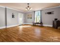 Spacious living room featuring new hardwood flooring and abundant natural light at 528 Sherrill Ave, Lincolnton, NC 28092