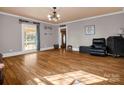 Bright living room showcasing hardwood floors, a large window, and a decorative ceiling fixture at 528 Sherrill Ave, Lincolnton, NC 28092