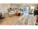 Bright living room filled with plants, natural light, and a comfortable seating area at 9009 Cebu Ct, Fort Mill, SC 29708