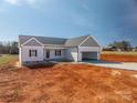 New construction featuring an inviting open garage, lawn and a charming exterior at 1282 Beal Rd, Lincolnton, NC 28092