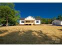 Beautiful home with classic architectural details, lush lawn, and a detached garage at 1311 Mack Dr, McConnells, SC 29726